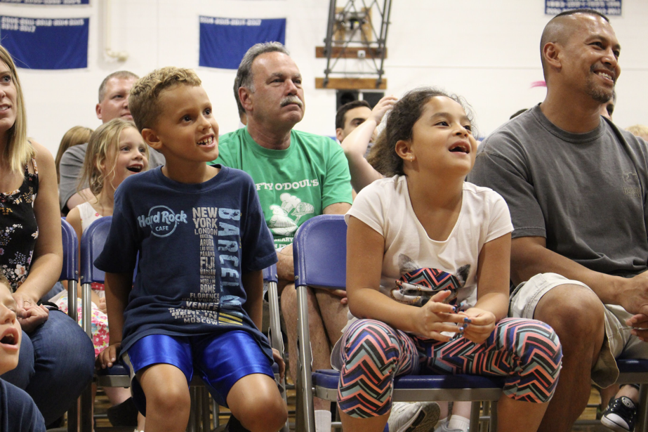 Families focused on Tim at the evening show